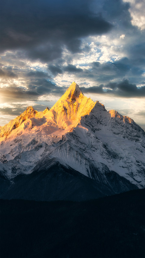 The menzmu peak is bathed in sunlight like a golden preview