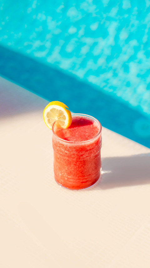 Ice cold red fruit cocktail by the pool preview