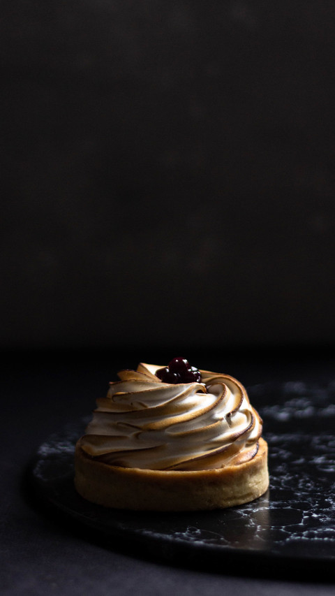Delicious mini lemon tart with white cream and berries preview