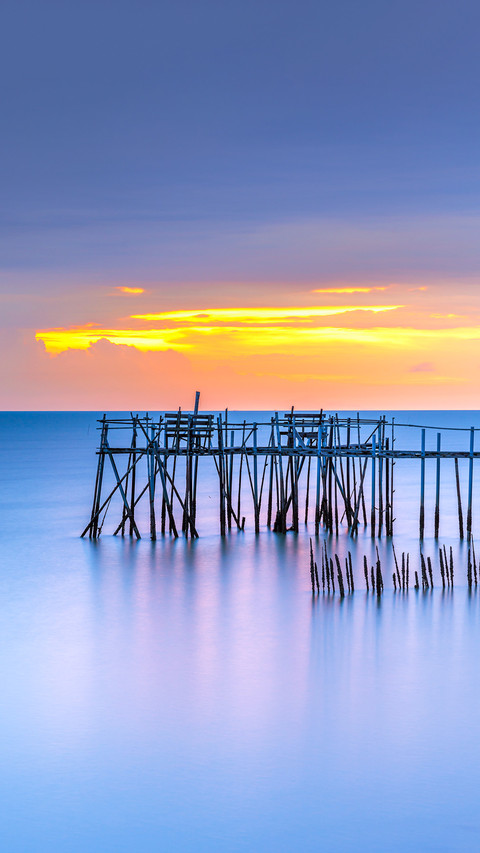 A sunset view of wooden fishermen jetty with nets preview