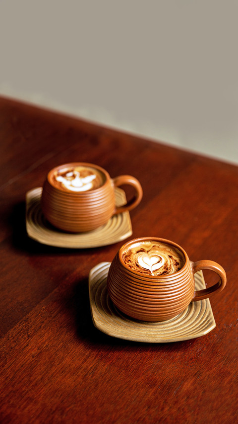 Two Brown Cups of Hot Cappuccino on Wooden Table preview