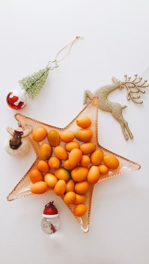 Colorful Christmas Ornaments, Citrus Fruits, and Festive Atm preview