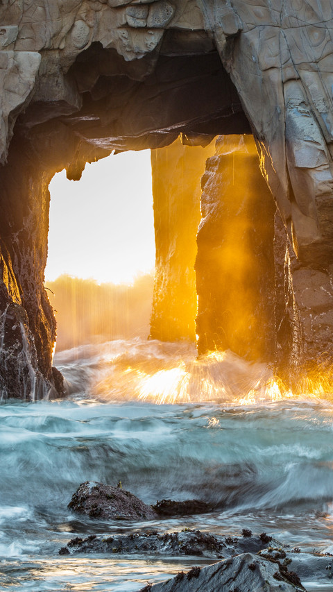 The beach arches the sea and the setting sun preview