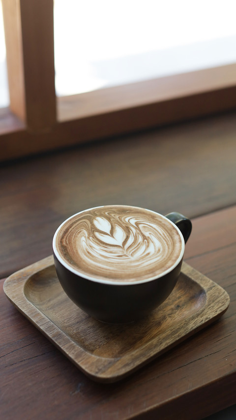 coffee latte on wood bar preview
