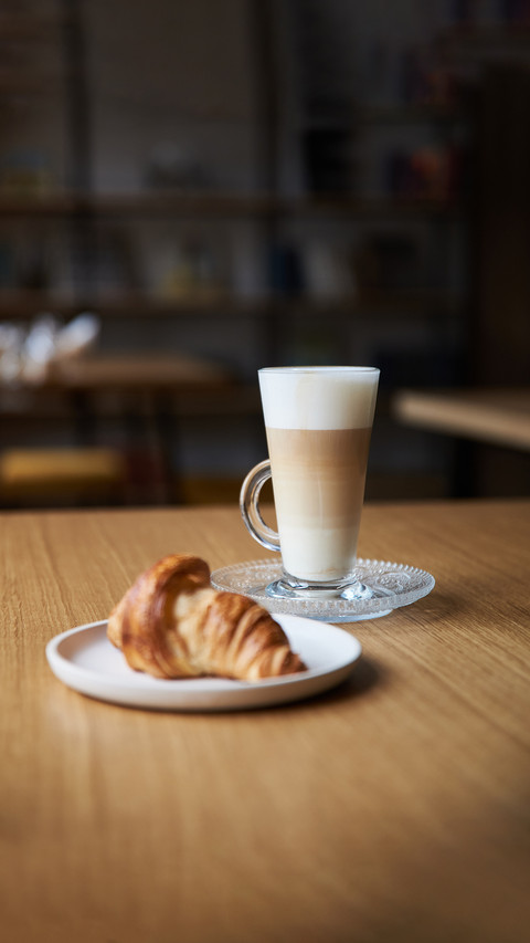 Coffee and croissant on the table preview