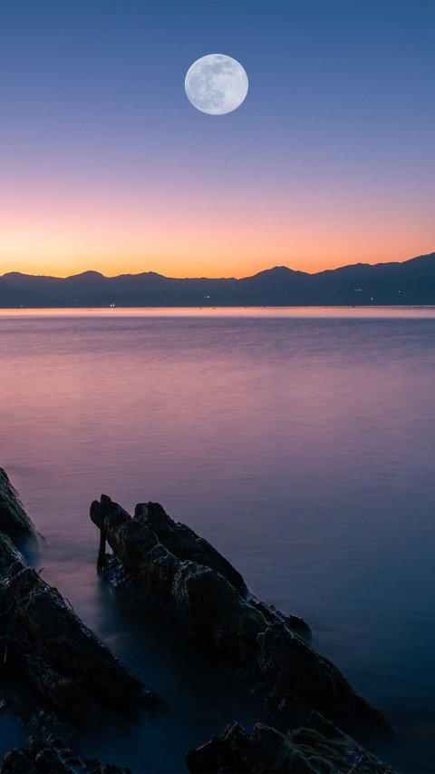 The moon rises over fuxian lake preview