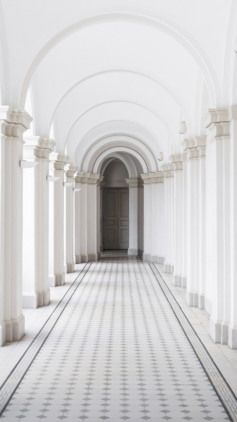 White arch corridor with tiled floor in 19th century preview