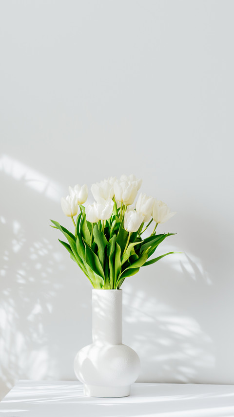 Scandinavian home interior with bouquet of white tulip preview