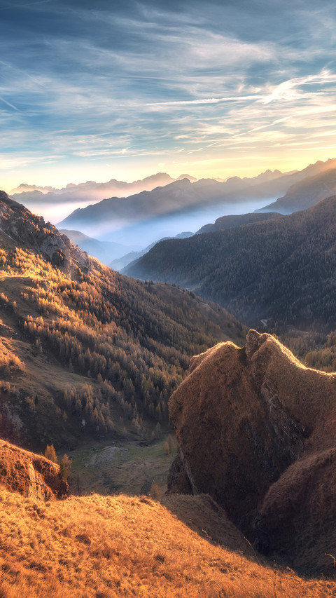Mountains in fog at beautiful sunset in autumn preview
