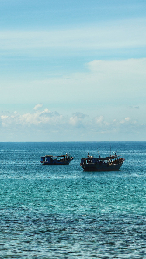 A small fishing boat by the seaside preview