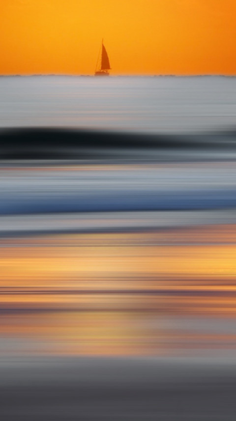 Seascape sailboat under an orange sky preview