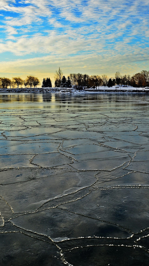 Dawn breaks through the ice lake's morning light preview