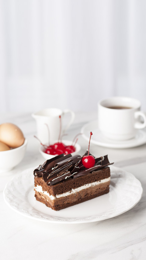 Still life of chocolate cake with white blurred background preview
