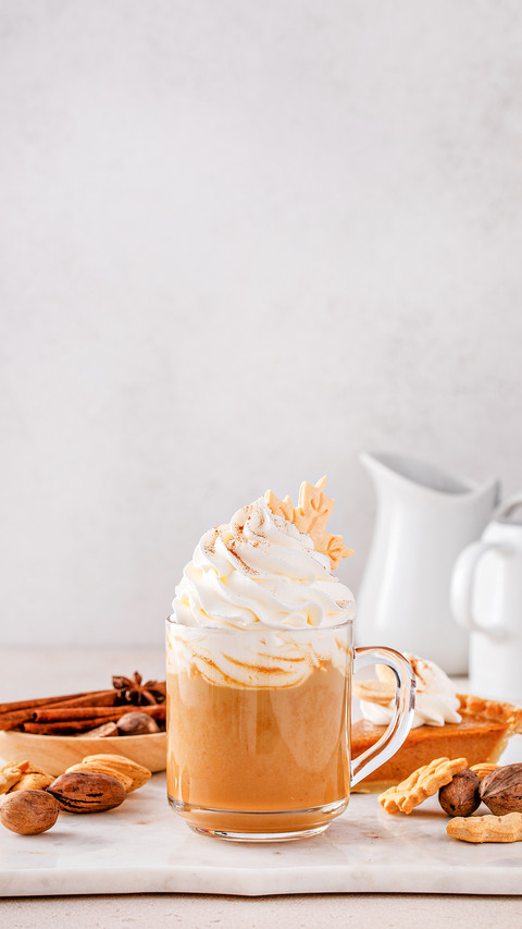 Pumpkin spice latte topped with whipped cream preview