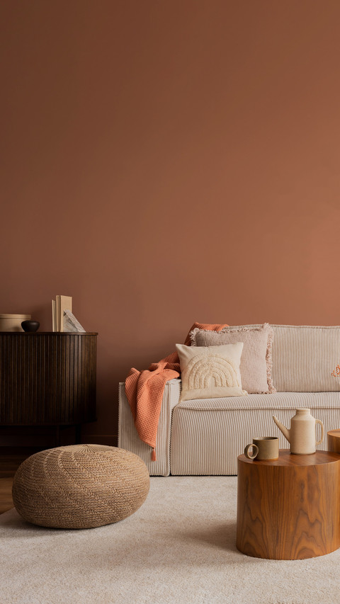 Warm and cozy living room interior with mock up poster frame preview