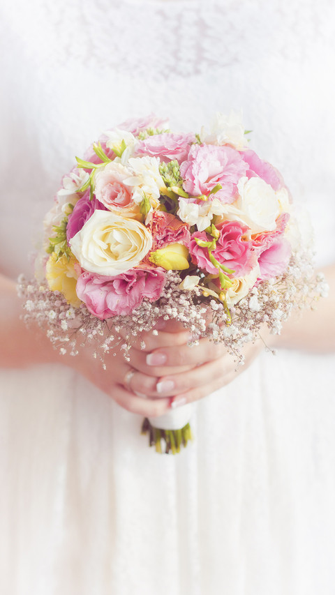Bride Holding Wedding Flower Bouquet in Hands preview
