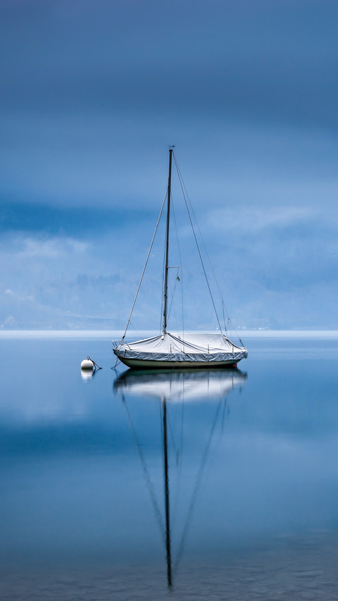A solitary boat on the lake surface preview