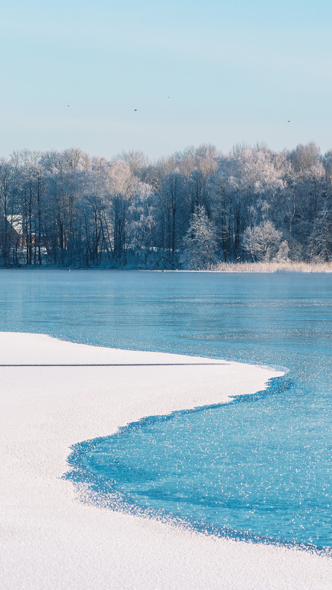 Wonderful white winter landscape with frozen lake preview