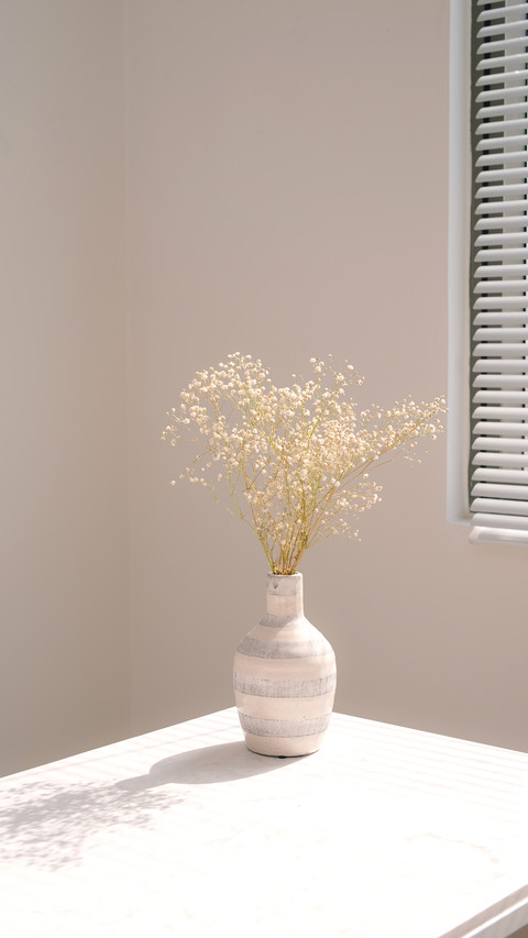 Beautiful spring flowers in vase on window preview