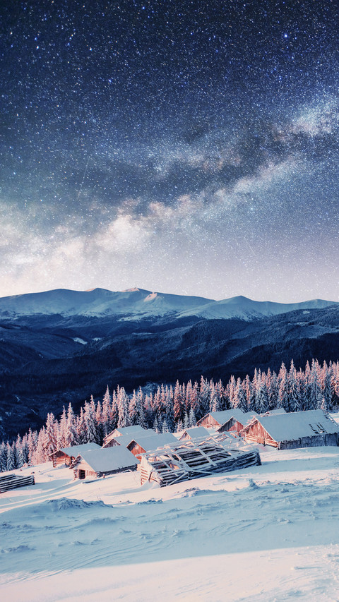 Snowy Mountains And wooden Houses Under The Stars preview