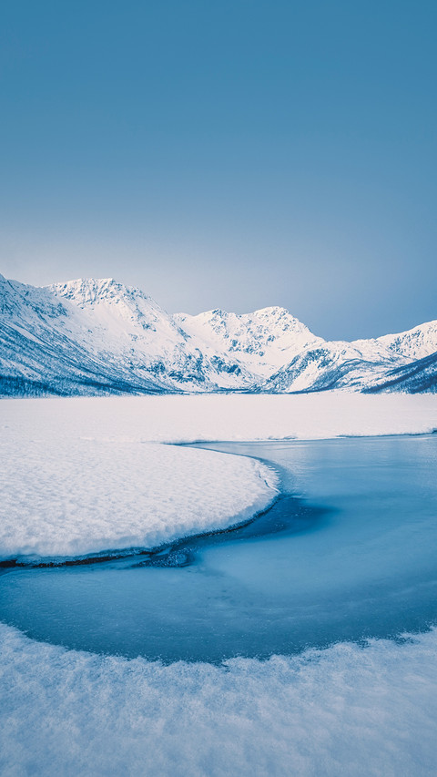 Snowy peaks, blue skies,  and frozen lakes preview