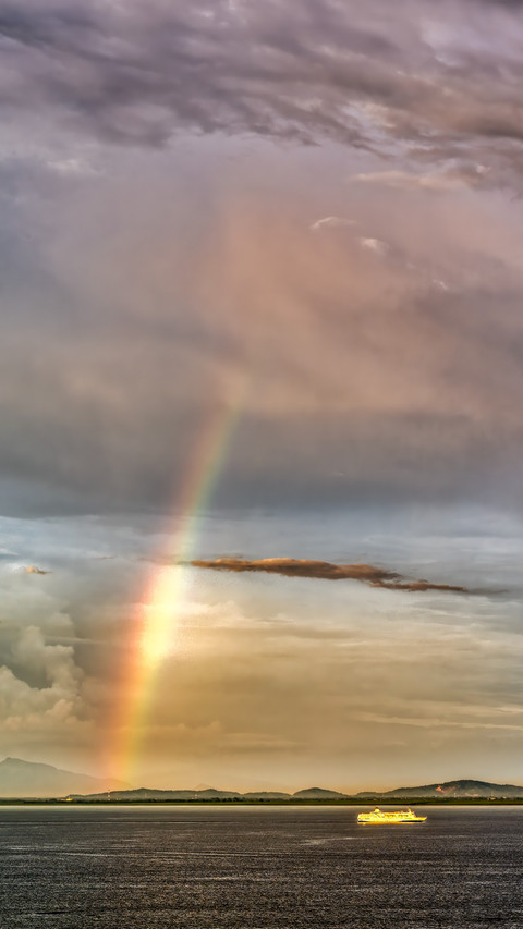 Rainbow on the sea at sunset preview