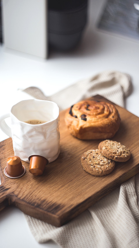 Drinking coffee with a muffin in the morning daylight preview