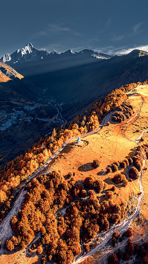 The snowcapped mountains and autumn forests in western preview