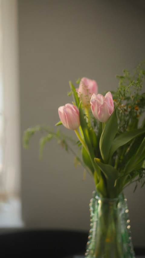 Tulips in a vase on the table preview