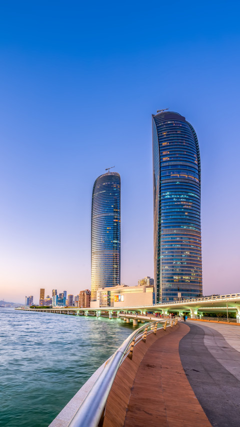 Twin Spiral Towers Reflect Sunset, City Skyline is a Picture preview