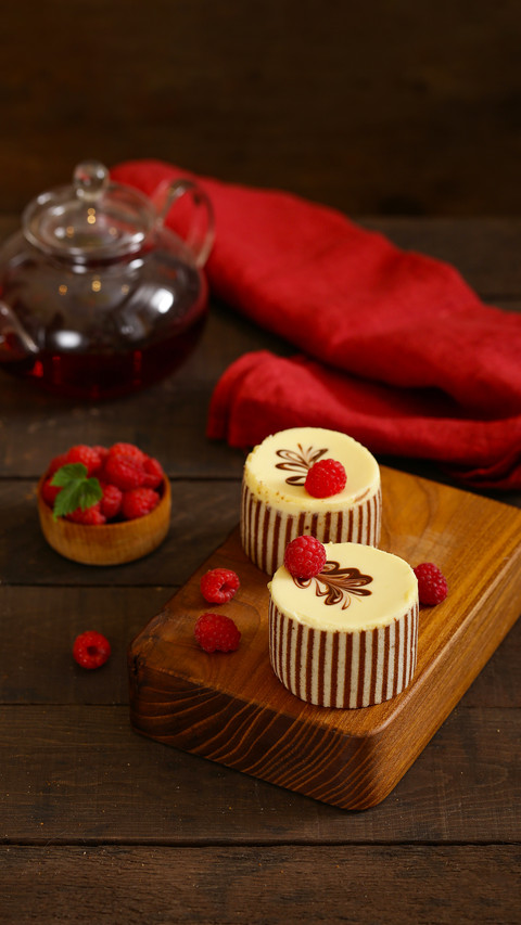 Three chocolate cake with fresh raspberries preview