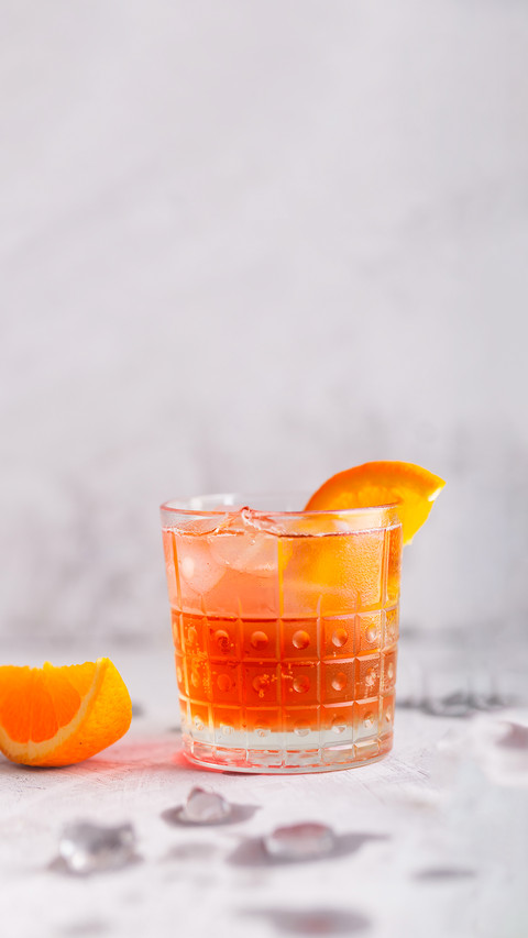 Fresh ice tea summer cocktail with orange and ice in glass preview