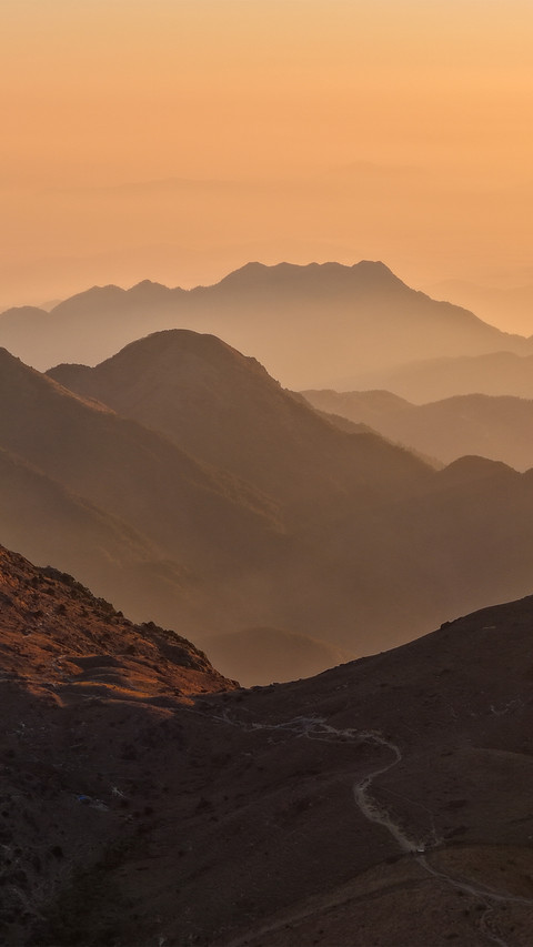The golden morning glow layers upon the mountains preview