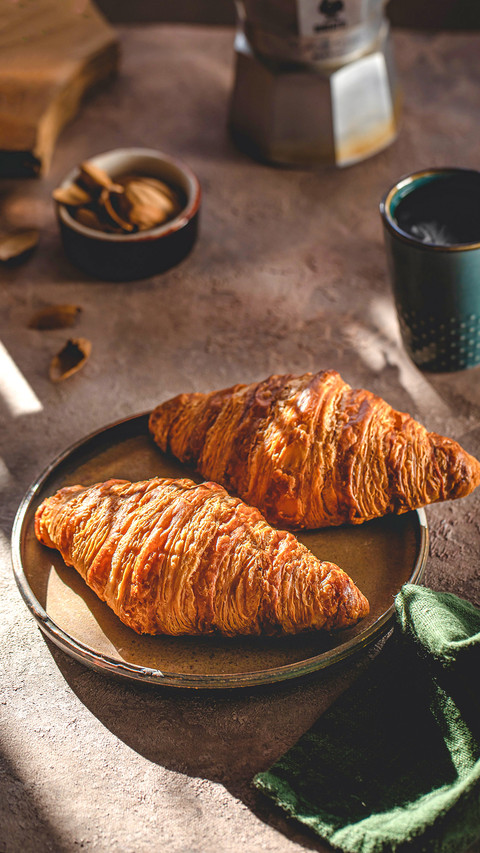 French croissant in the glare of the sun preview
