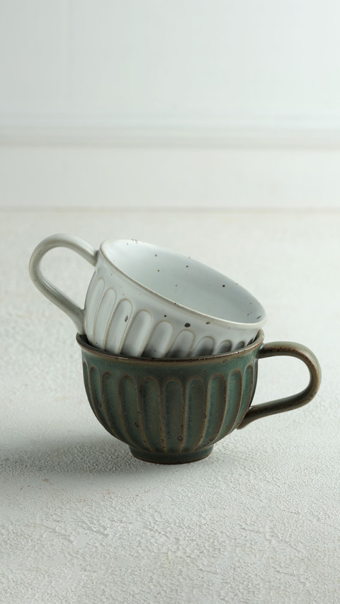 Pottery cups on white background preview
