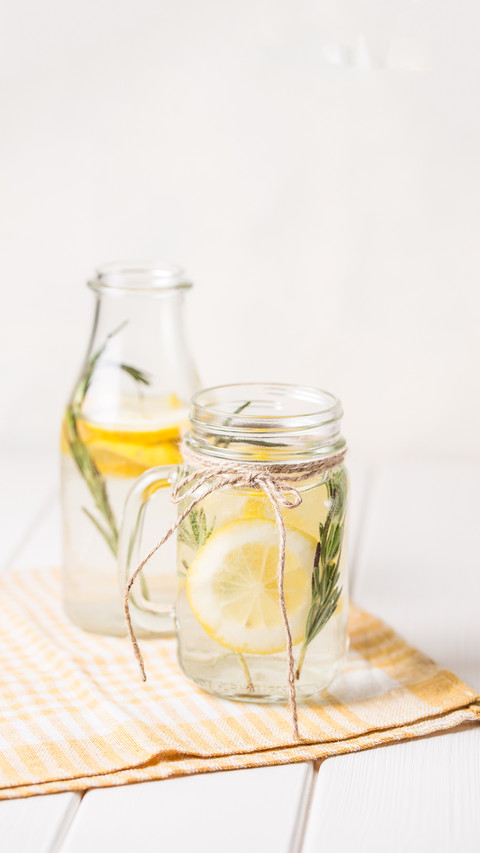 Glass and bottle of frozen homemade lemonade preview