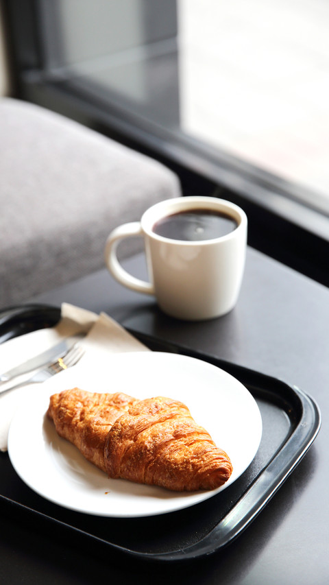 Croissant and coffee in coffee shop preview