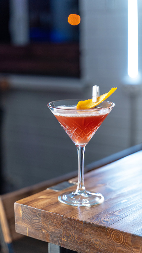 Cosmopolitan cocktail on wooden table preview