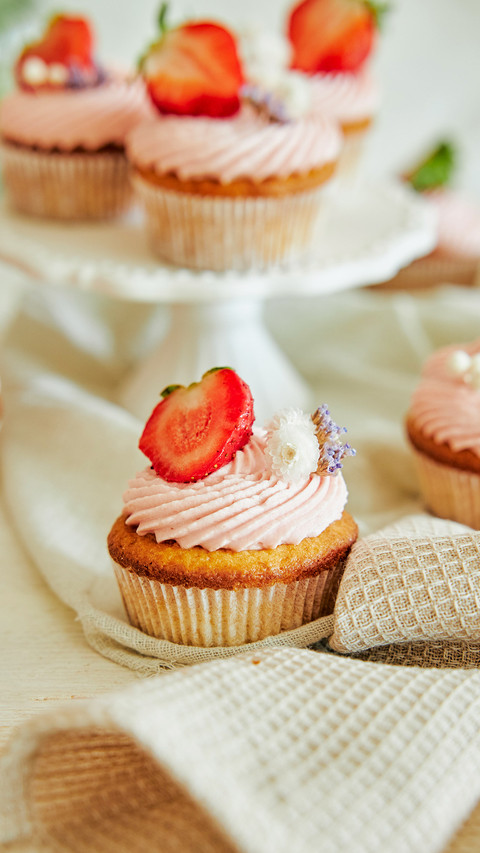 A vertical shot of delicious strawberry cupcakes preview