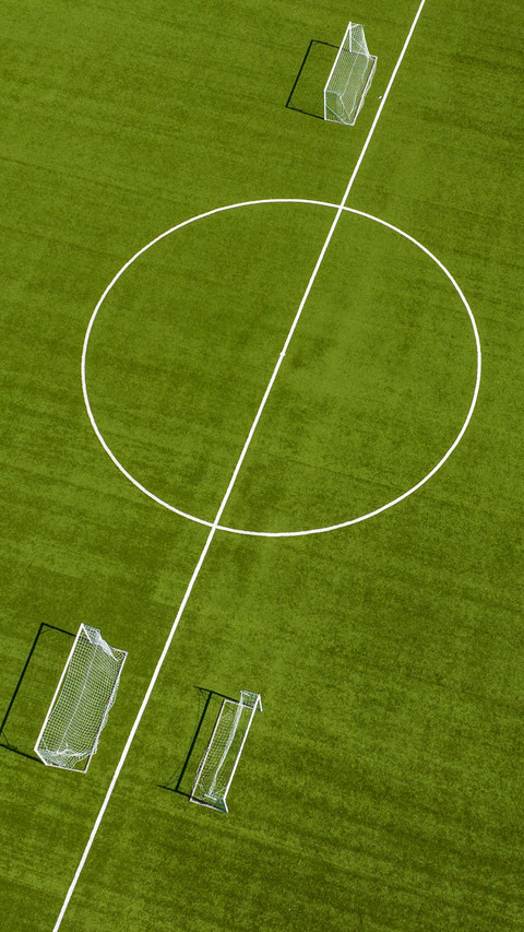 Close up of the midfield circle in an empty football field preview