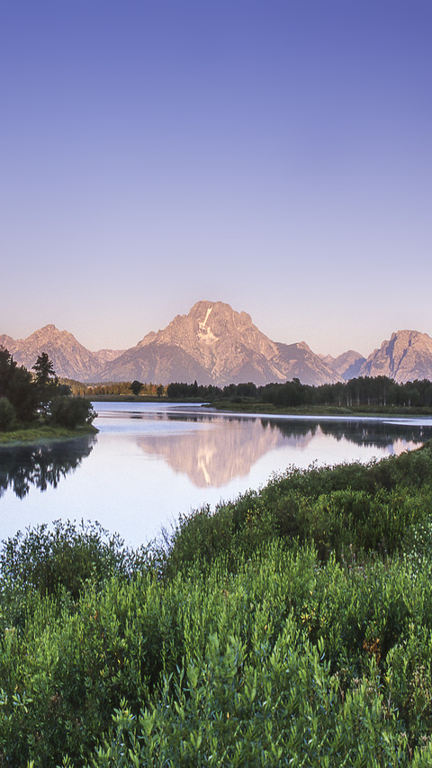 Scenic view of grand tetons and snake river preview