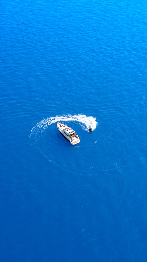 Water scooter movement close to the yacht aerial view preview