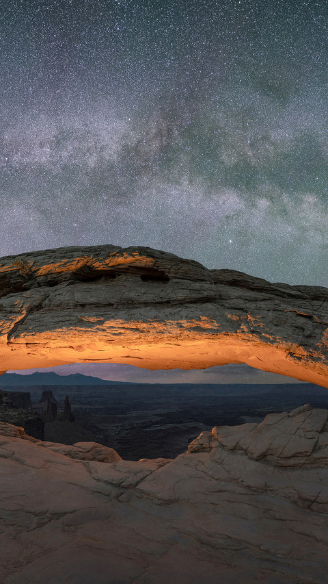 Beautiful starry night sky and Milky Way Galaxy over light preview