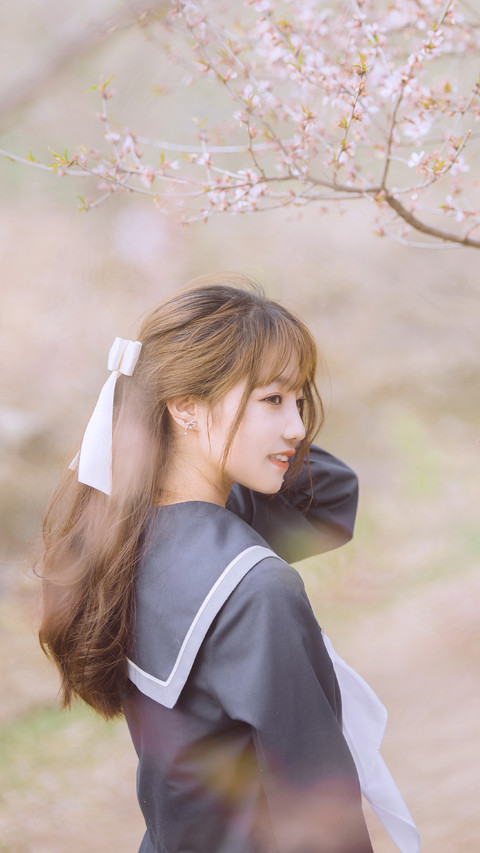 Female Students under Cherry Trees in Spring preview