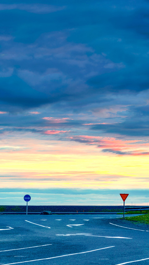 Concrete road with traffic signs and colorful cloud sky preview