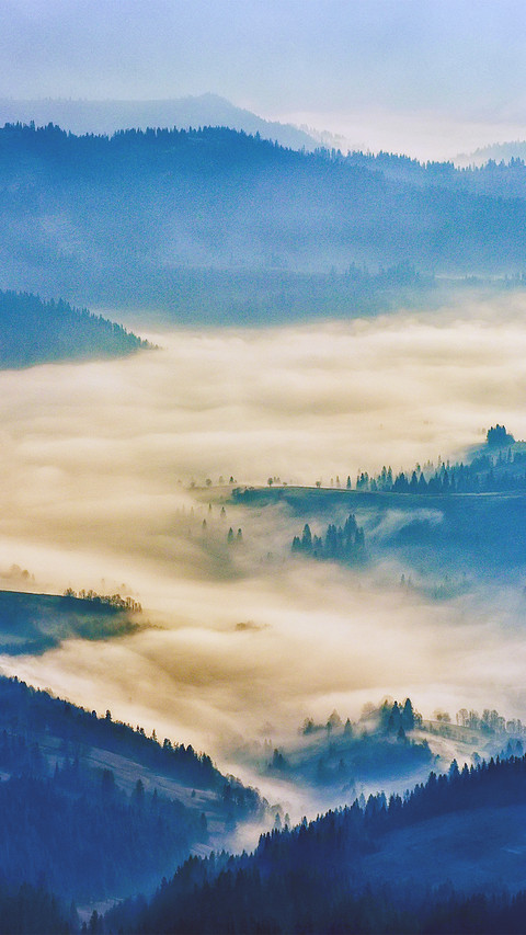 Clouds and mist surround the mountains preview
