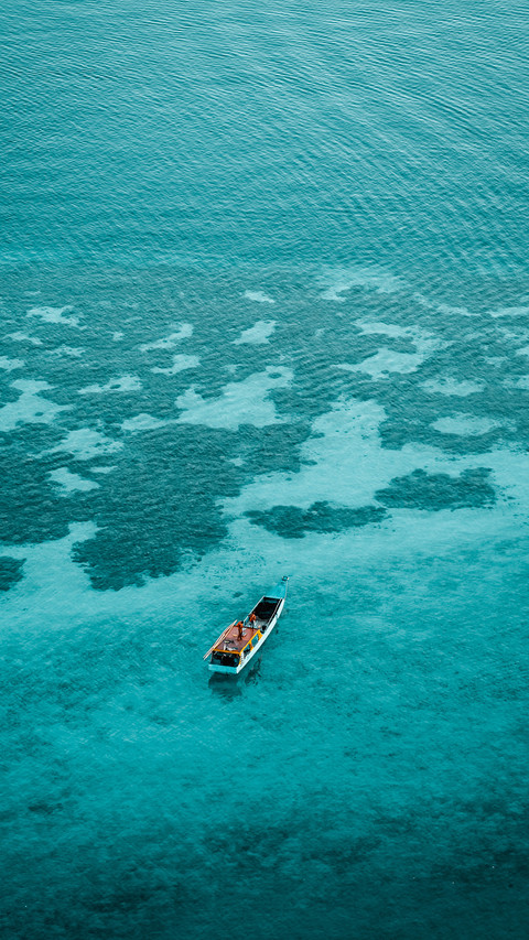 A boat from above over a coral reef preview