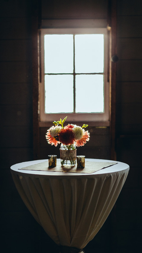 Bouquet of flowers in a vase on the table by the window preview