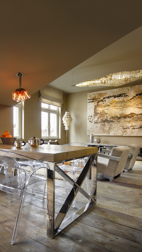 Transparent plastic chairs around table with chrome frame preview