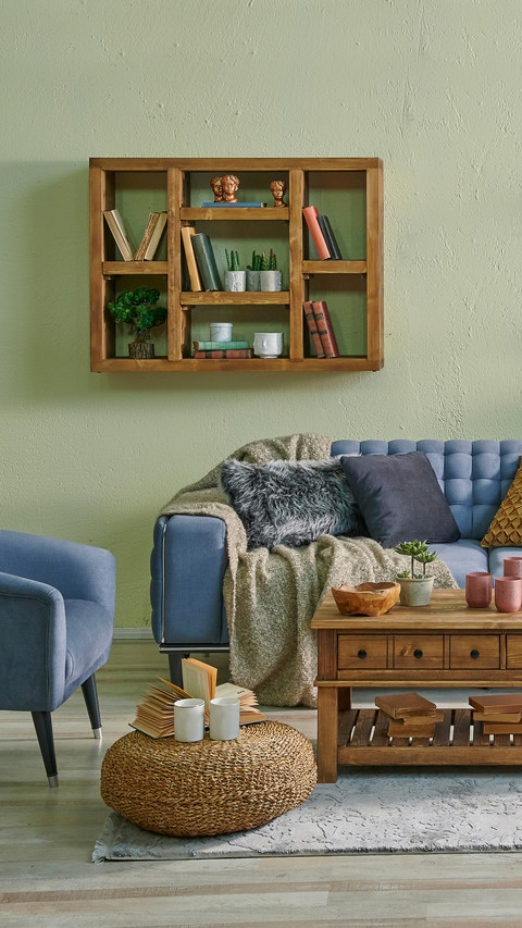 Living Room with Blue Sofa and Hanging Decorations preview